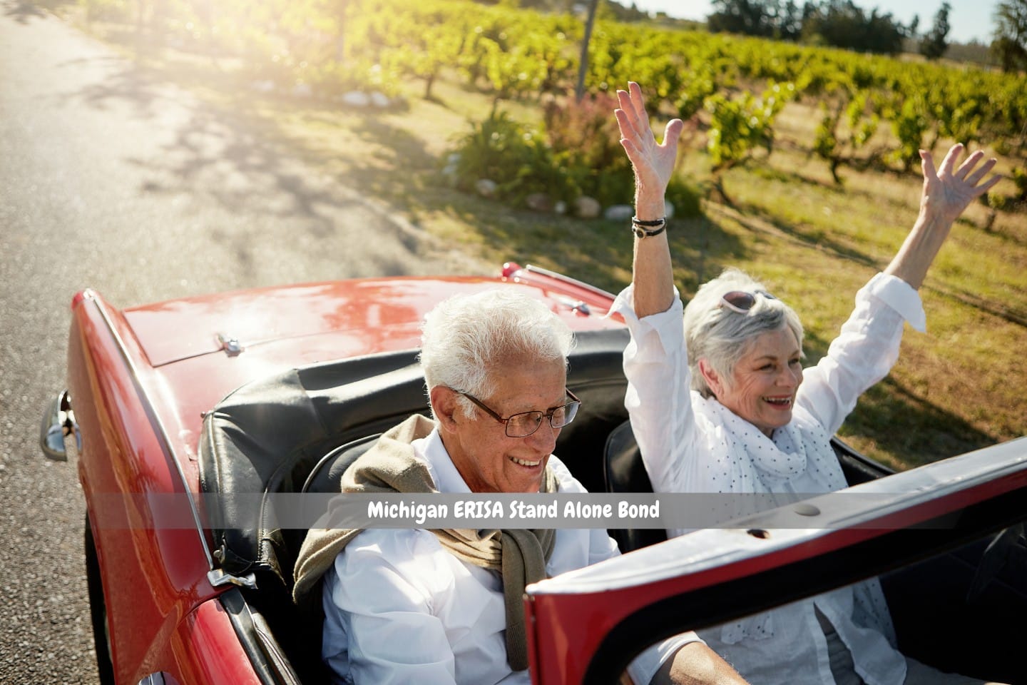 Michigan ERISA Stand Alone Bond - A satisfying pursuits in retirement. Two retired couple riding a convertible red car.