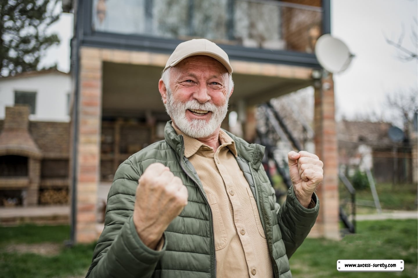 An elderly retiree is shown in the picture standing in front of his comfortable cottage.