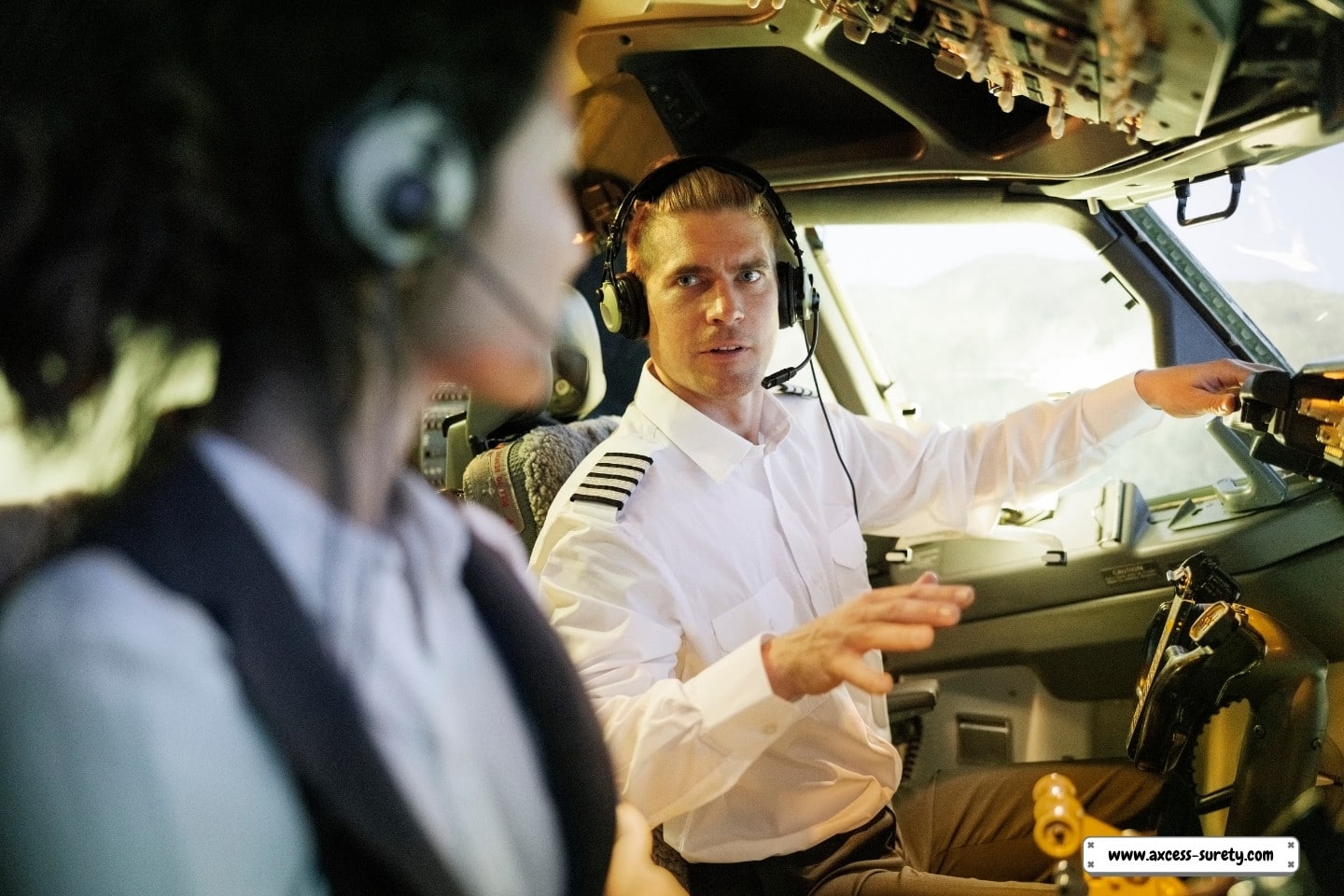 During flight simulation, the pilot and co-pilot converse in the cockpit.