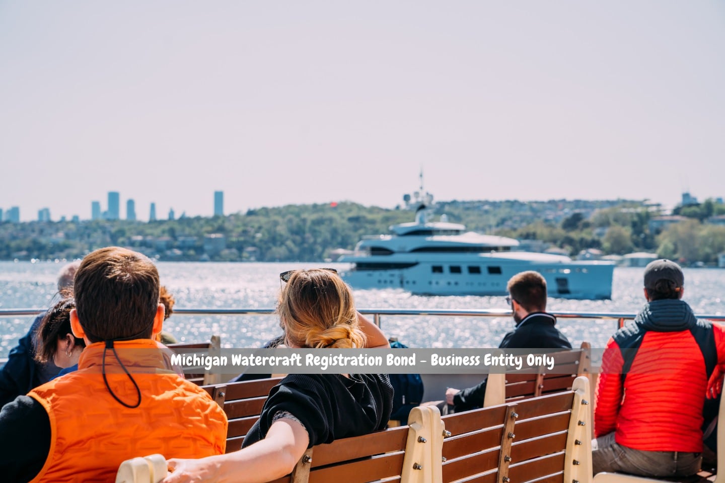 Michigan Watercraft Registration Bond - Business Entity Only - A passenger taking in the scenery while seated on a watercraft.