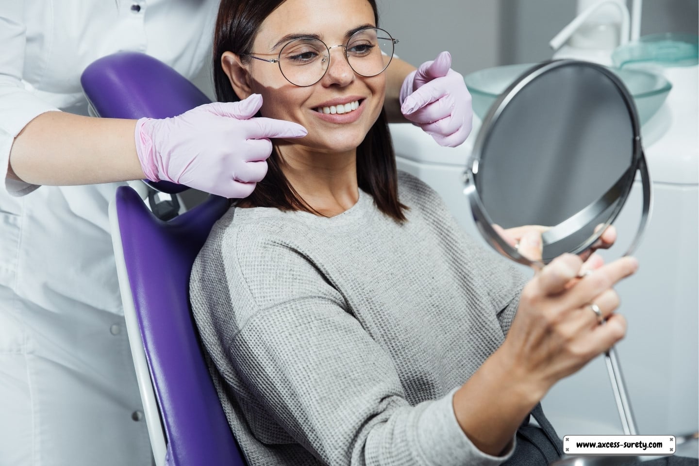 A stunning woman at the dentist's office, admiring her stunning teeth.