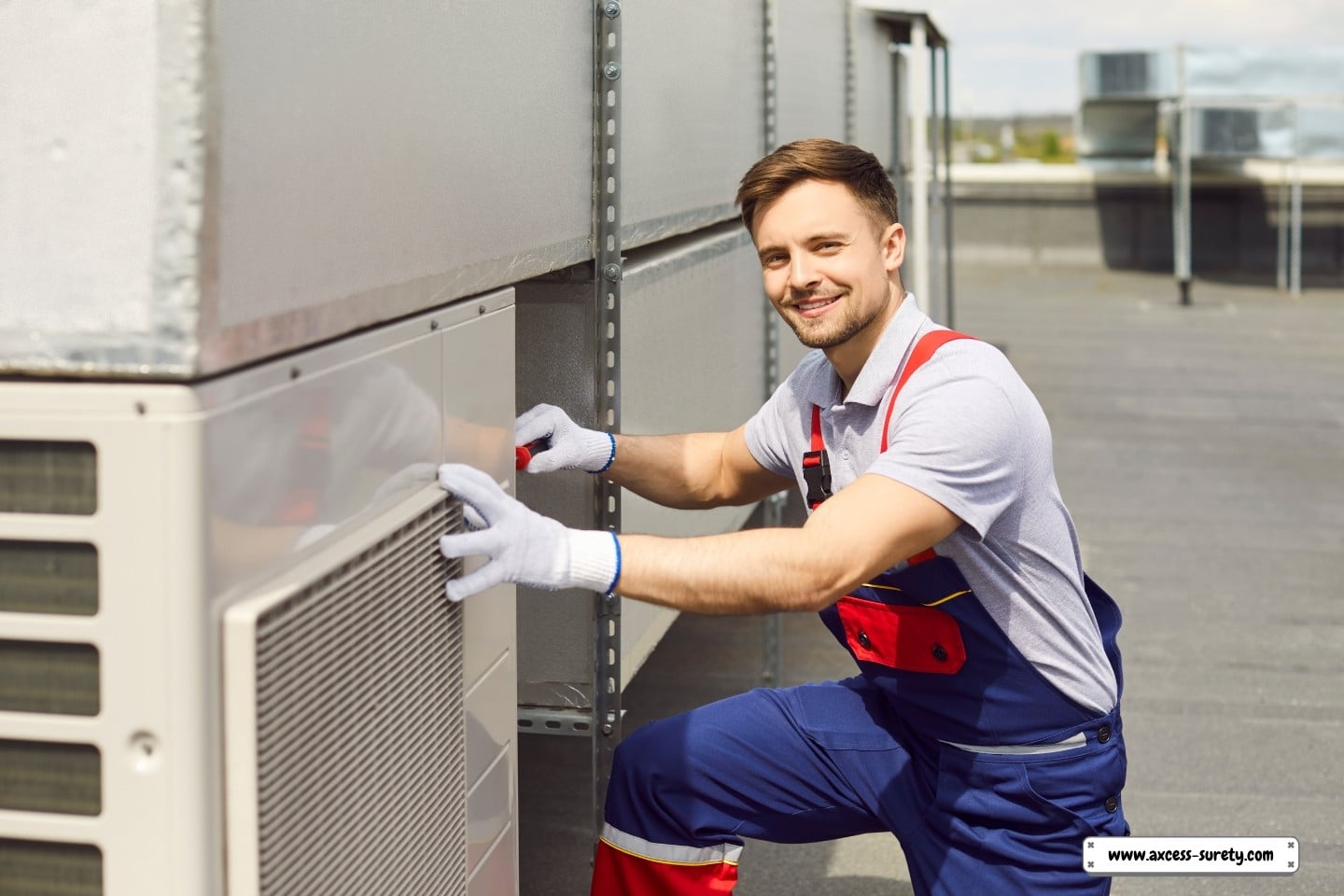 An engineer inspecting and maintaining a rooftop HVAC system.