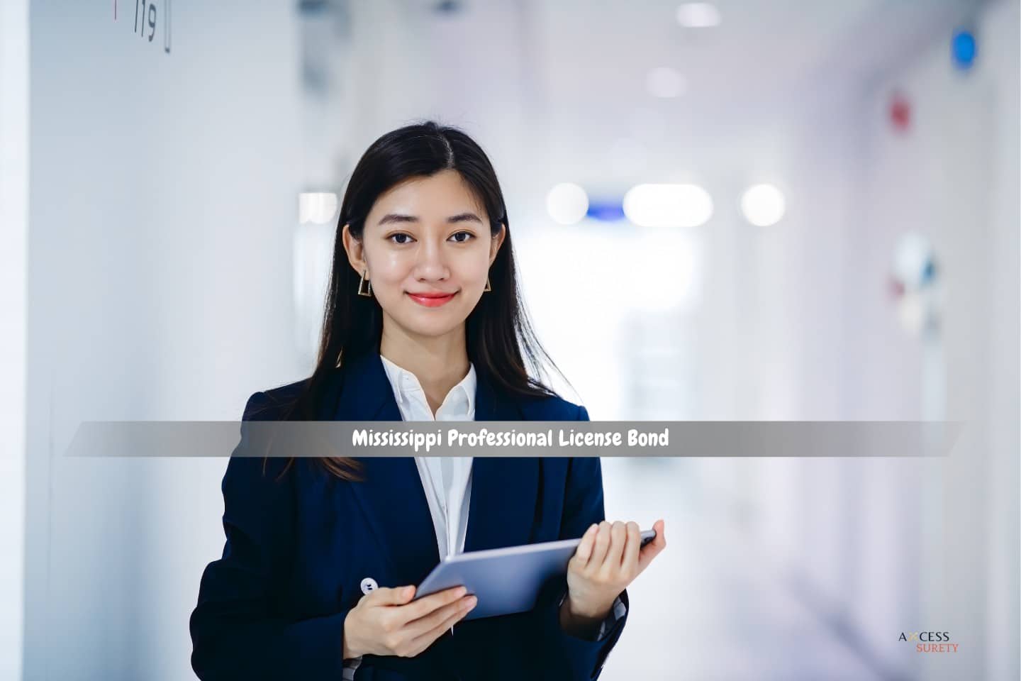 Mississippi Professional License Bond - An Asian professional working in an office.