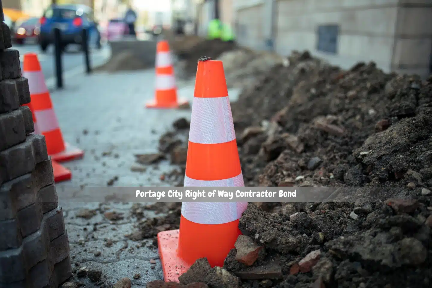 Portage City Right of Way Contractor Bond - Sidewalk reconstructed, orange cone for warning sign, cars, and people walking.