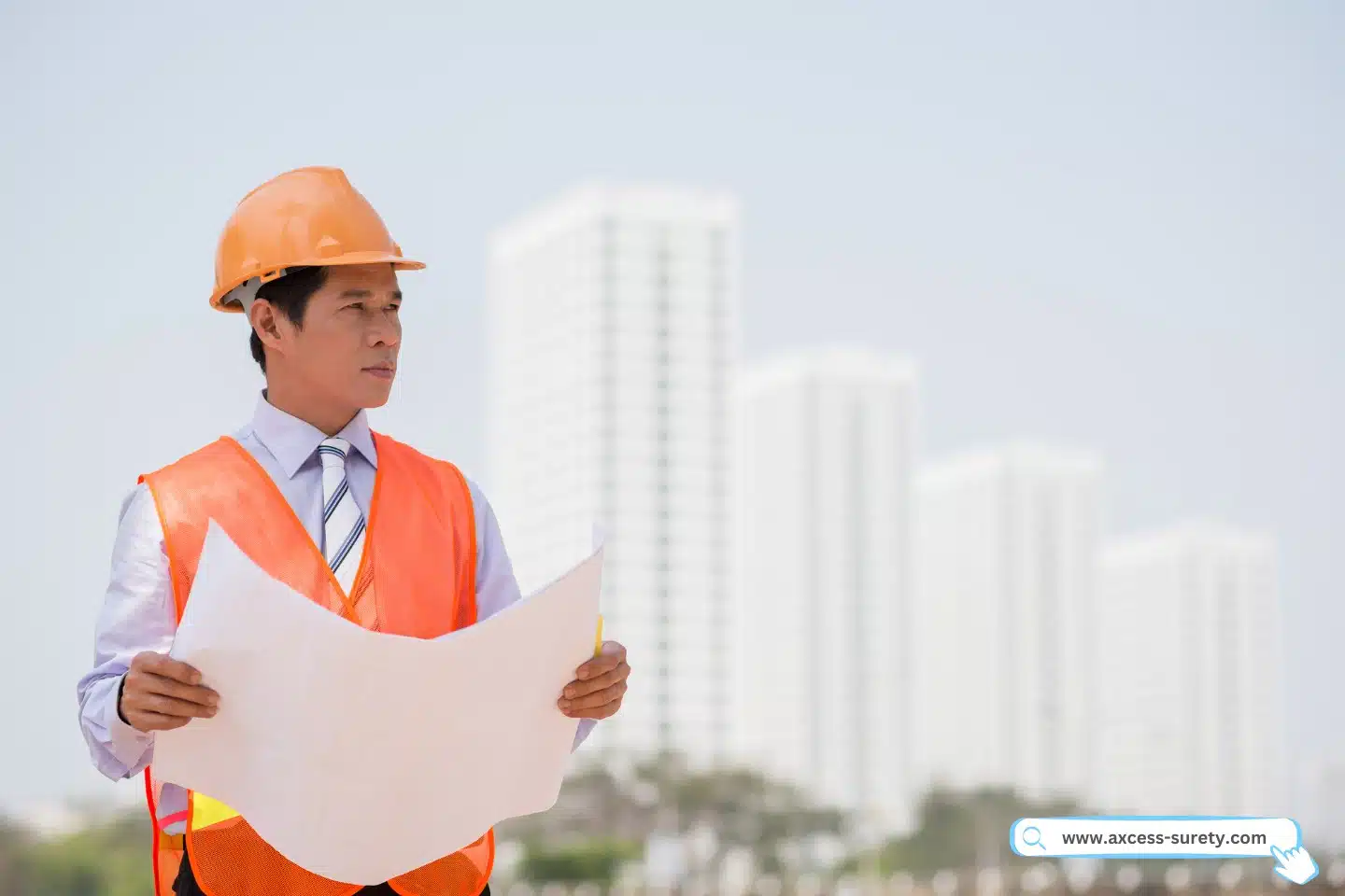 Portrait of serious contractor holding his blueprint in full uniform.