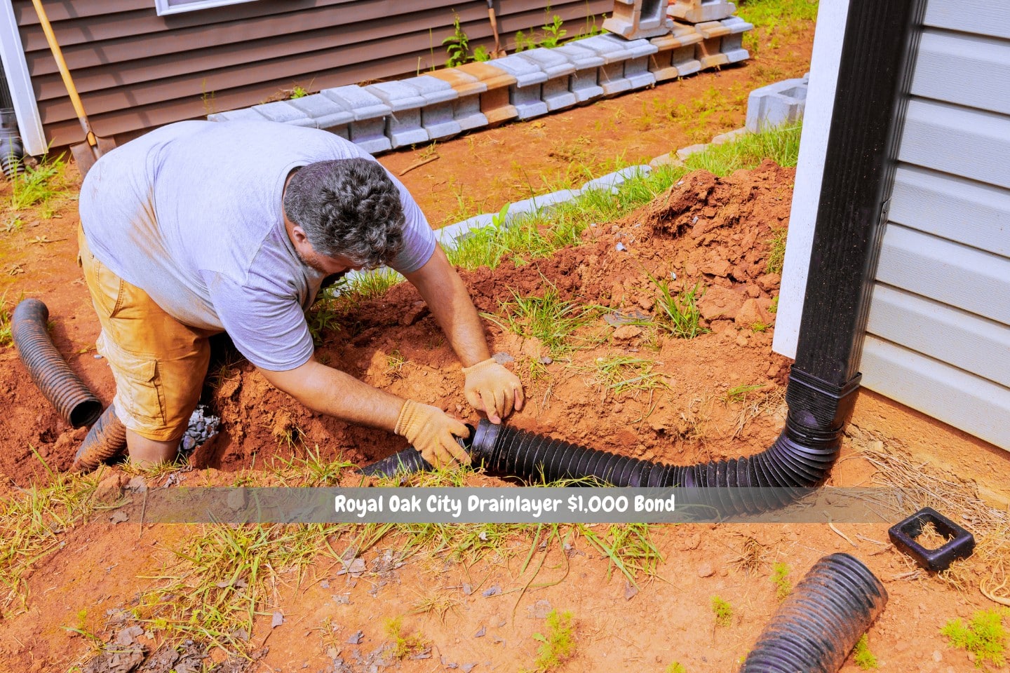 Royal Oak City Drainlayer $1,000 Bond - The downspout connector for the flexible gutter extension drainage pipe is being installed.