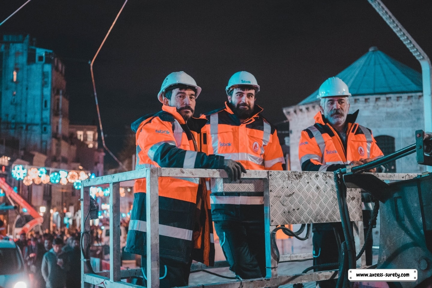 When working at night, construction workers wear reflective jackets and hardhats.