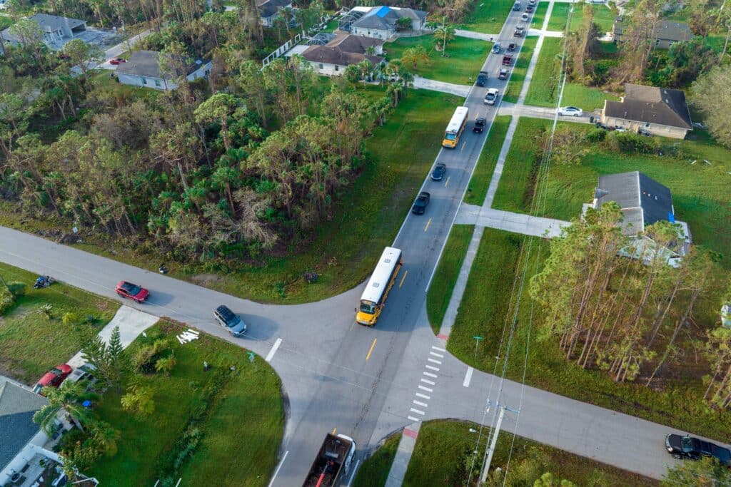aerial-view-of-american-yellow-school-bus-picking-2024-07-24-21-13-38-utc_11zon