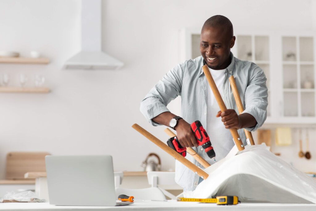 assemble-furniture-happy-african-american-man-scr-2023-11-27-05-34-22-utc_11zon