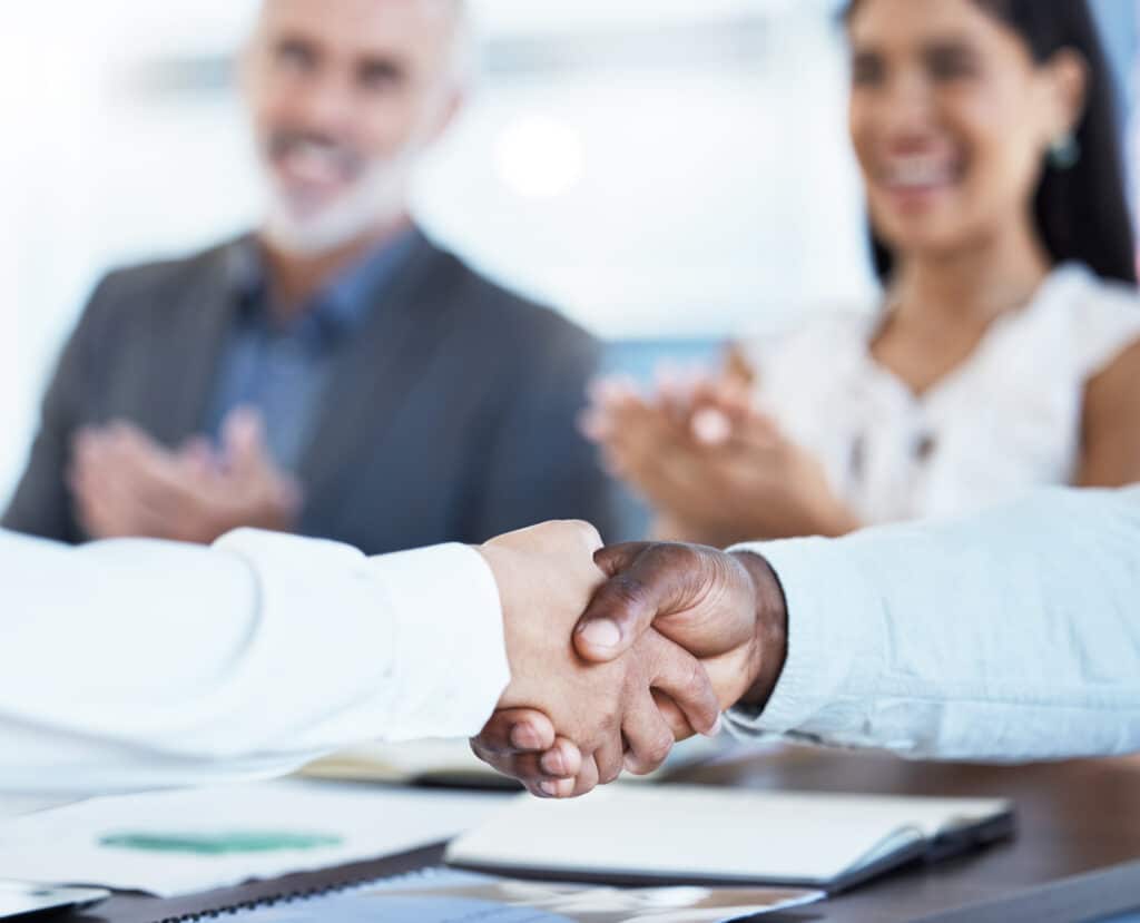 Business, partnership and handshake diversity deal with corporate partners clapping. Crm, meeting a.