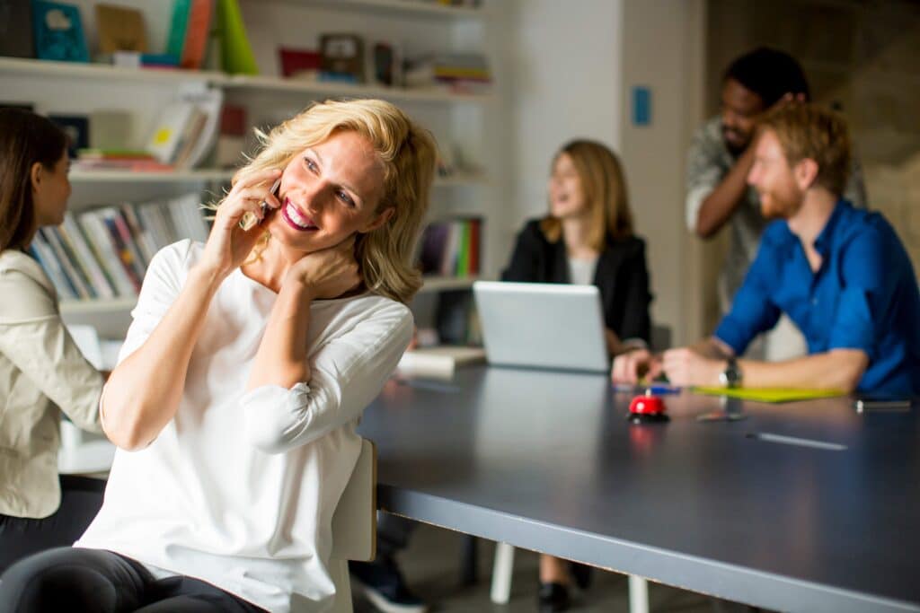 businesswoman-using-mobile-phone-in-office-2023-11-27-05-20-48-utc_11zon (1)
