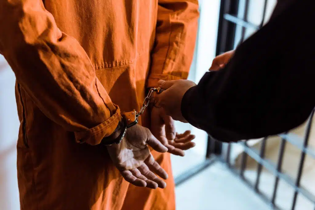cropped-image-of-prison-officer-wearing-handcuffs-2023-11-27-05-04-41-utc_11zon