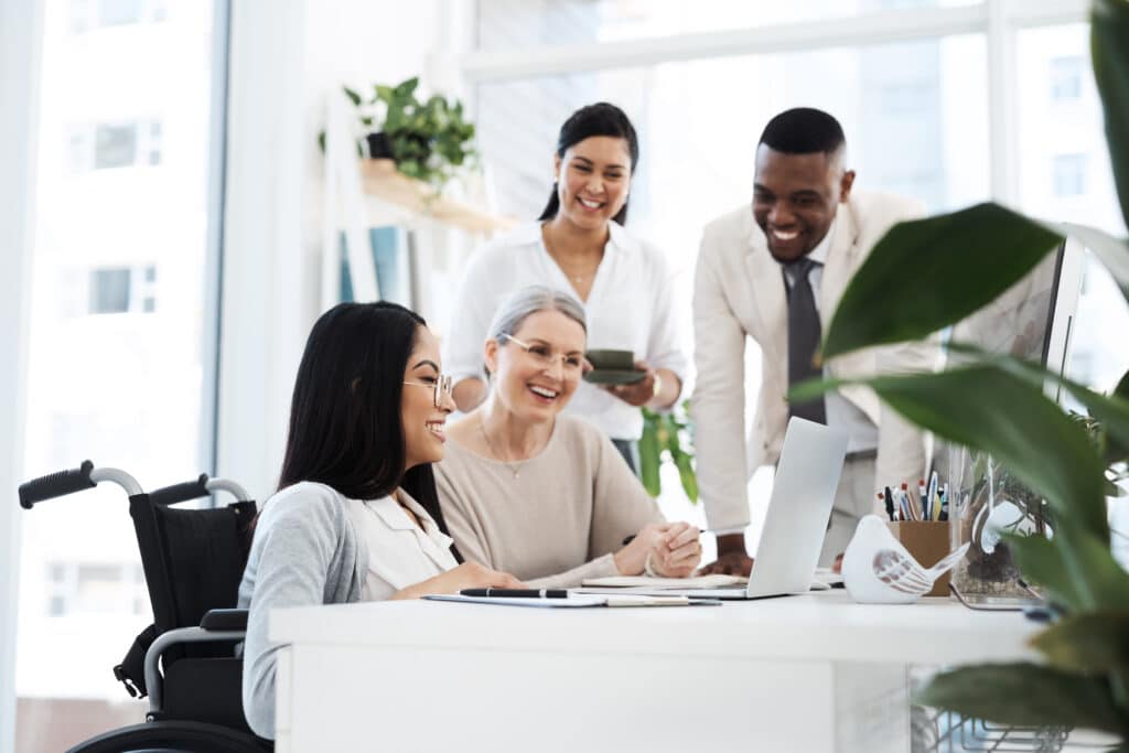 Cropped shot of a group of diverse businesspeople having an informal meeting in their office.