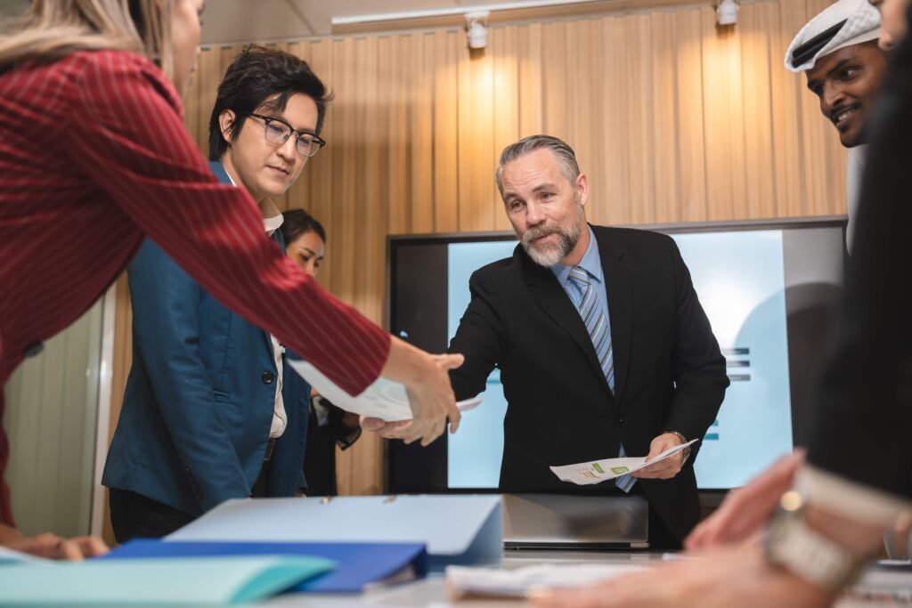 diverse-business-team-leader-discuss-financial-pap-2023-11-27-05-37-23-utc_11zon