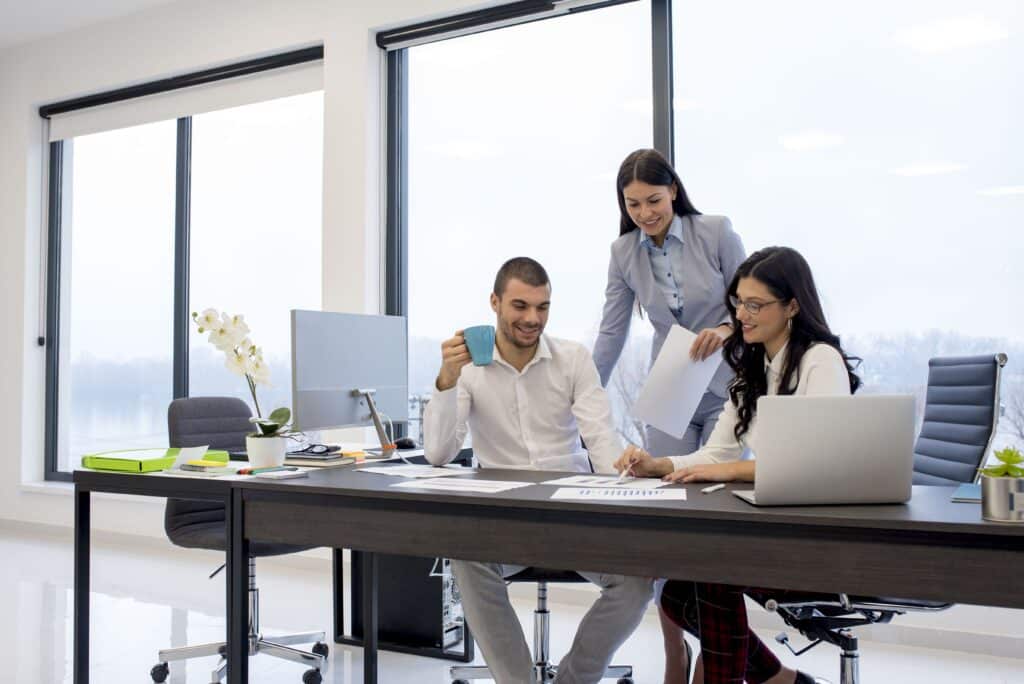 A group of the business people working in the office and discussing new ideas