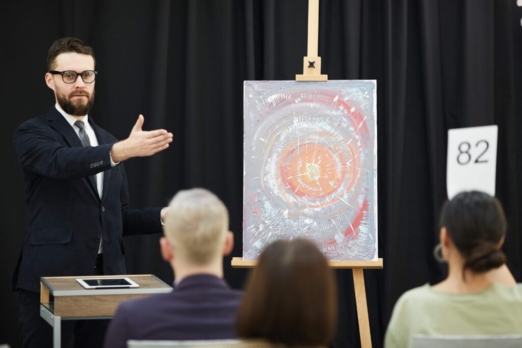 man-presenting-the-famous-painting-2023-11-27-05-09-42-utc_11zon