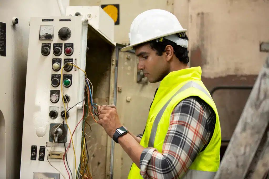 Industrial Engineers in Hard Hats.Work at the Heavy Industry Manufacturing Factory.industrial worker indoors in factory.aged man working in an industrial