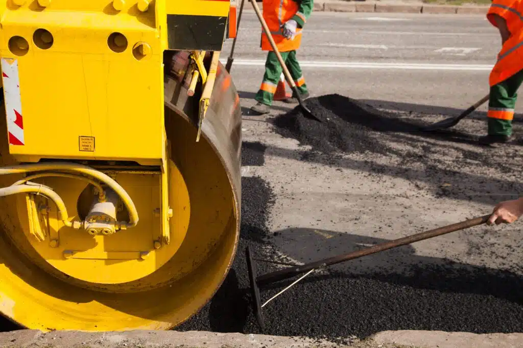 pavement-machine-laying-fresh-asphalt-or-bitumen-o-2024-08-08-08-02-52-utc_11zon
