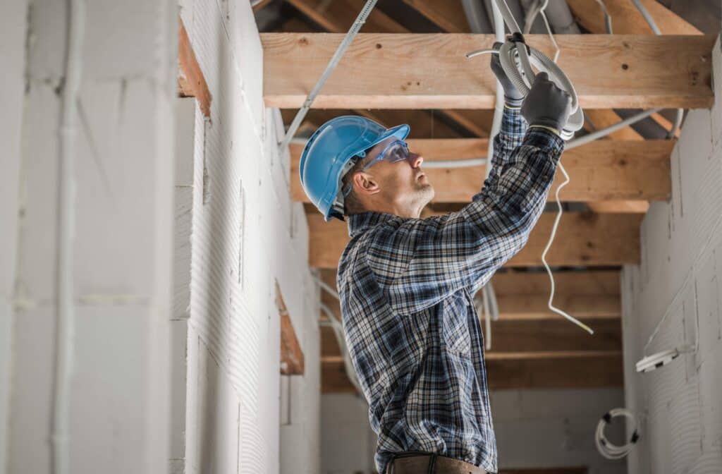 professional-electrician-installing-ceiling-light-2023-11-27-05-36-11-utc_11zon