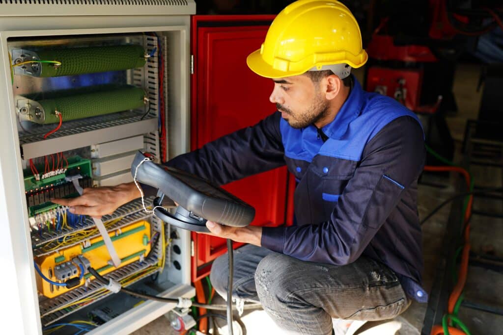 worker-at-machine-in-factory-metal-industry-worke-2023-11-27-05-03-45-utc_11zon