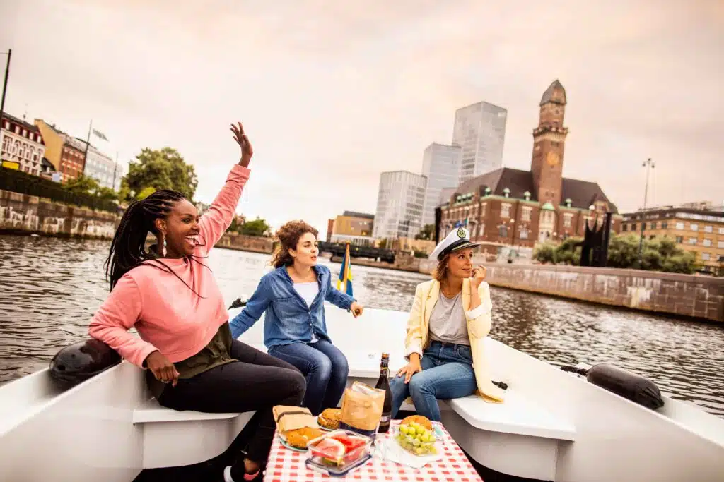 young-female-friends-having-picnyoung-female-friends-having-picnic-on-boat-tour-2024-10-11-13-42-41-utc_11zonic-on-boat-tour-2024-10-11-13-42-41-utc_11zon