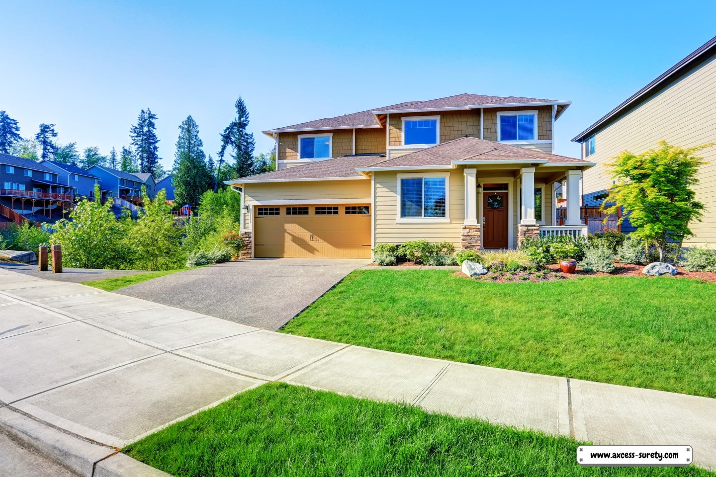 lovely curb appeal of a high-end, beige home.