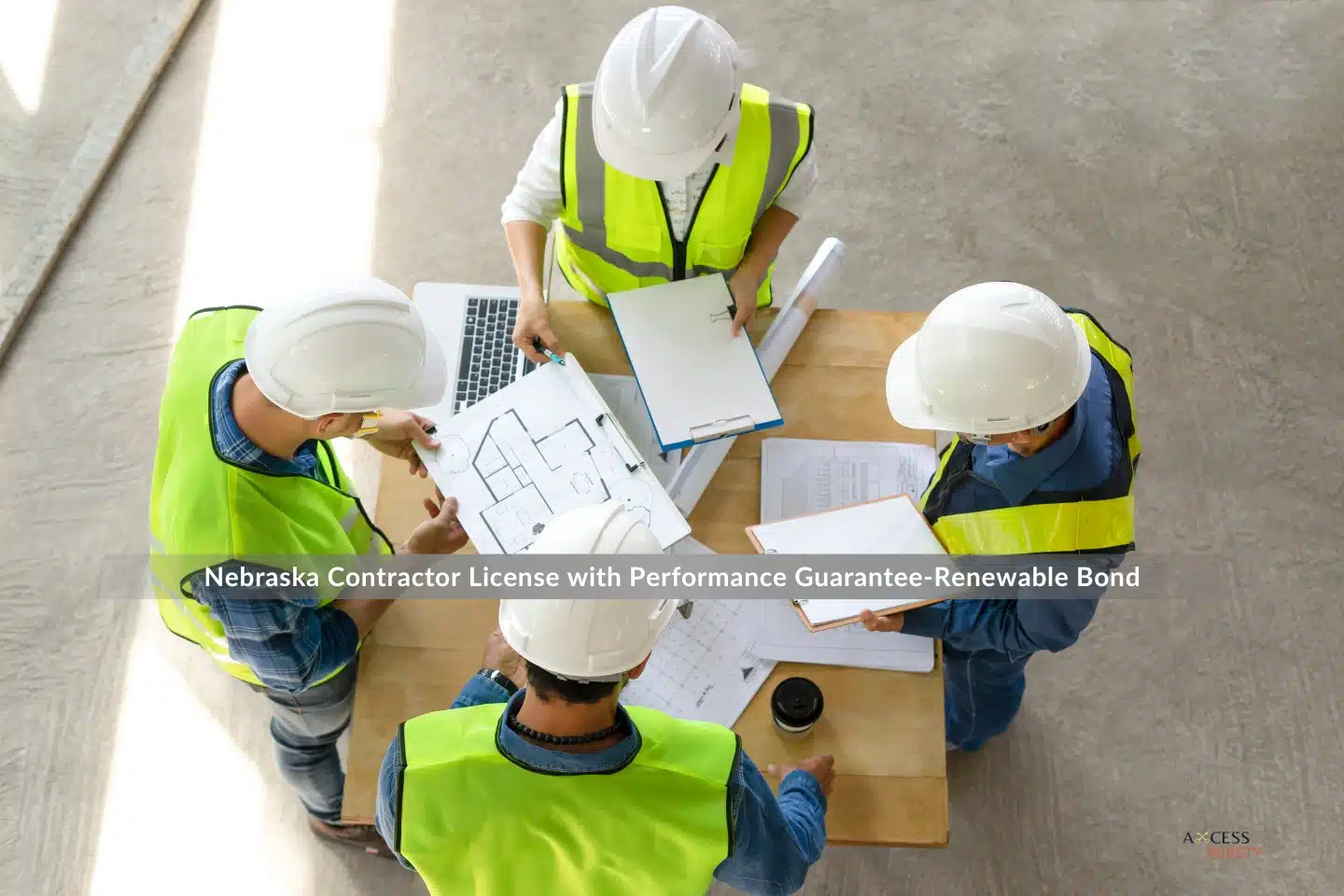 Nebraska Contractor License with Performance Guarantee-Renewable Bond - An overhead picture of the engineering team meeting in the building that is currently being constructed.