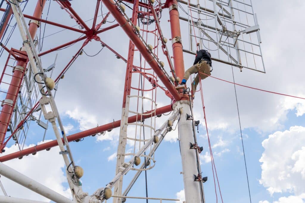 a-worker-with-climbing-equipment-serves-a-city-tv-2023-11-27-05-28-07-utc