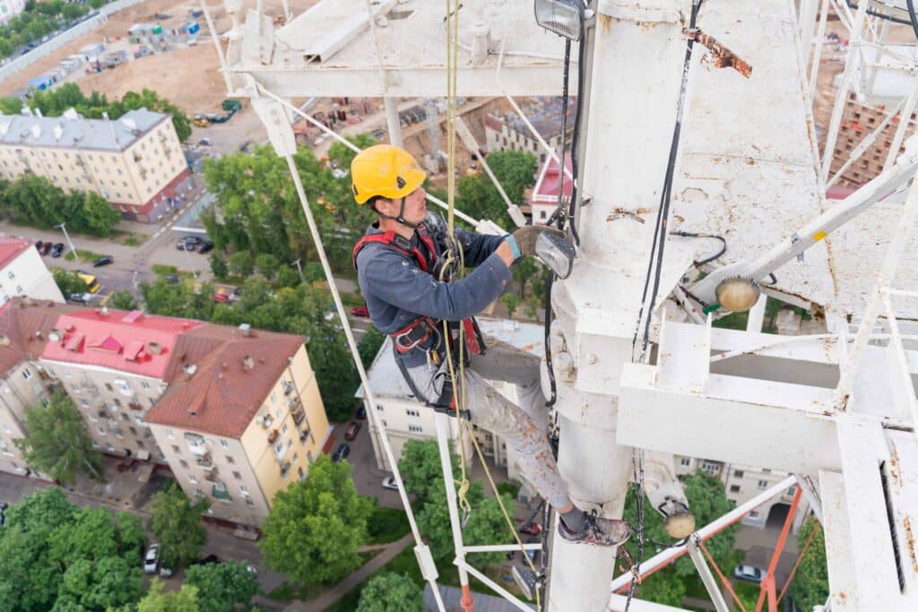 a-worker-with-climbing-equipment-serves-a-city-tv-2023-11-27-05-31-53-utc_11zon