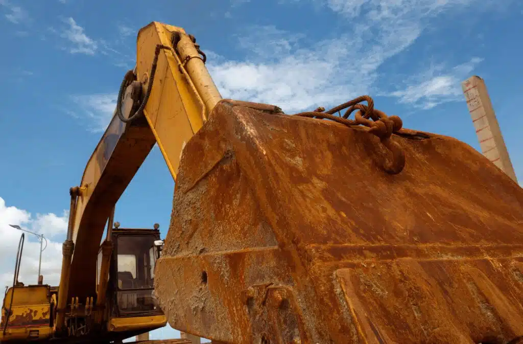 closeup-rusty-metal-bucket-of-old-backhoe-parked-a-2024-01-15-18-15-45-utc_11zon