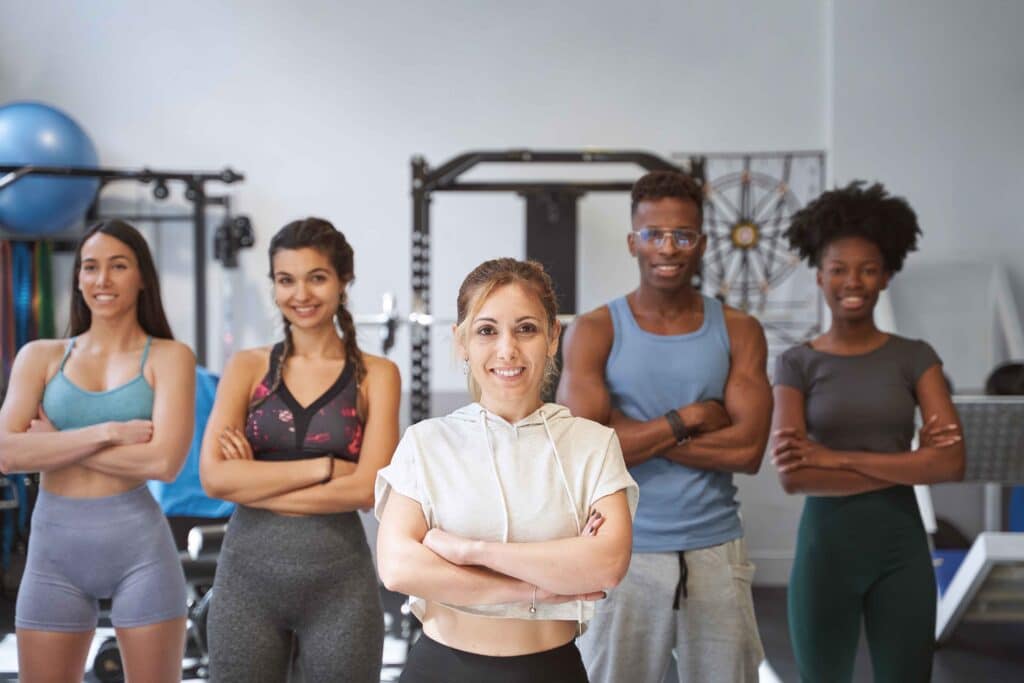 confident-female-trainer-standing-in-front-of-team-2023-11-27-05-08-57-utc_11zon