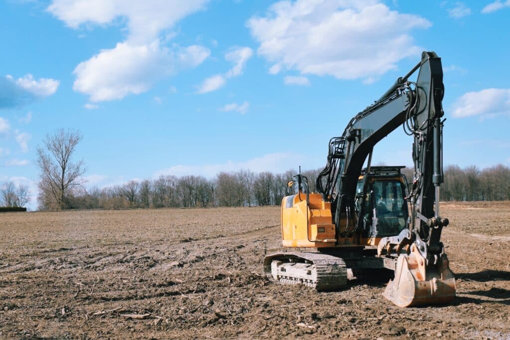 excavator-on-an-empty-field-2023-11-27-04-57-13-utc
