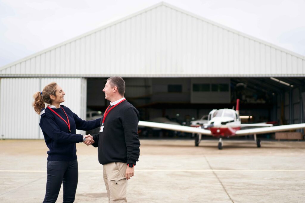 female-flight-instructor-congratulating-her-studen-2023-11-27-05-25-21-utc_11zon