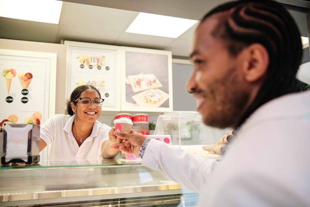 friendly-worker-serving-an-ice-cream-terrine-to-a-2023-11-27-04-56-37-utc_11zon