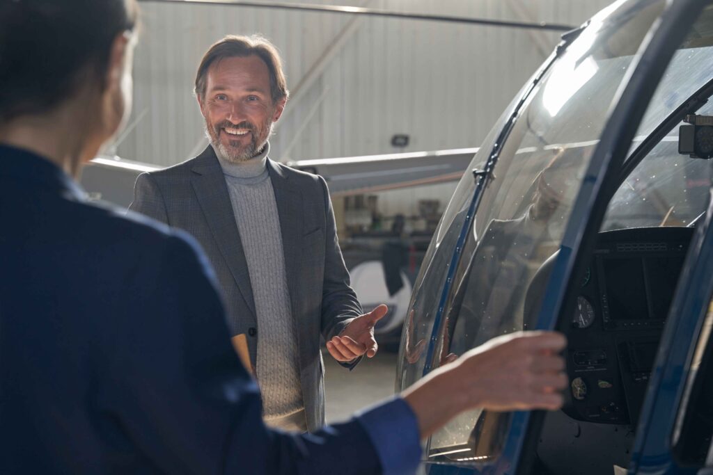 high-spirited-aircraft-hangar-manager-talking-to-h-2023-11-27-05-20-29-utc_11zon