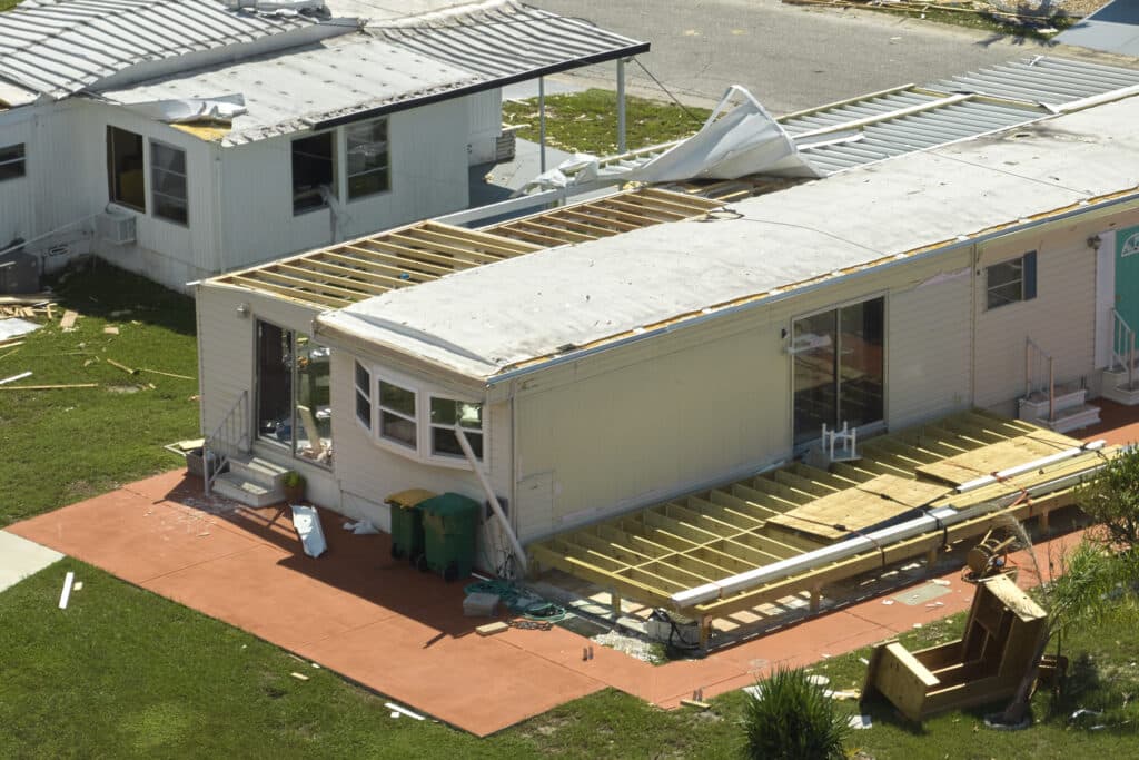 Hurricane Ian destroyed house in Florida residential area. Natural disaster and its consequences.