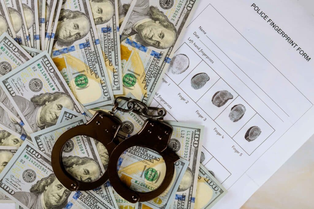 judge-in-handcuffs-fingerprint-us-dollars-on-a-co-2023-11-27-04-50-05-utc_11zon