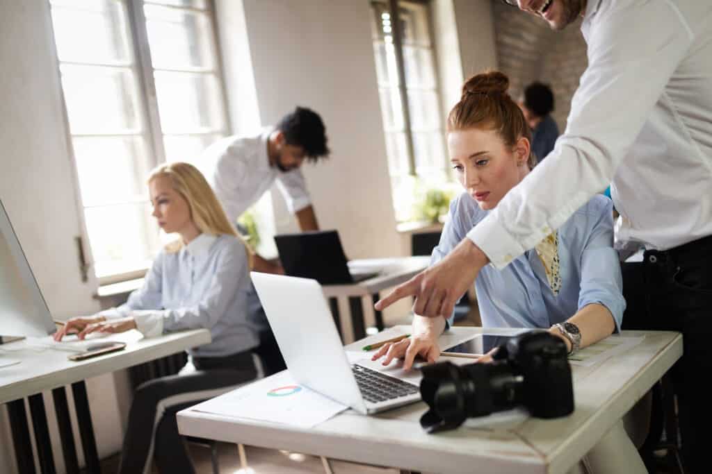 Successful happy group of students learning software engineering and business during presentation