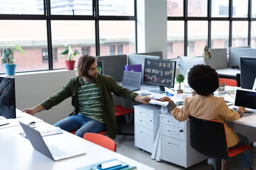 two-diverse-business-people-working-in-creative-of-2023-11-27-05-25-58-utc