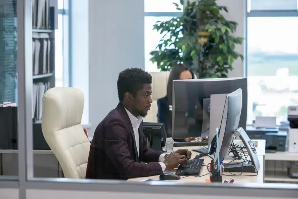 young-serious-african-businessman-looking-at-compu-2023-11-27-05-23-41-utc