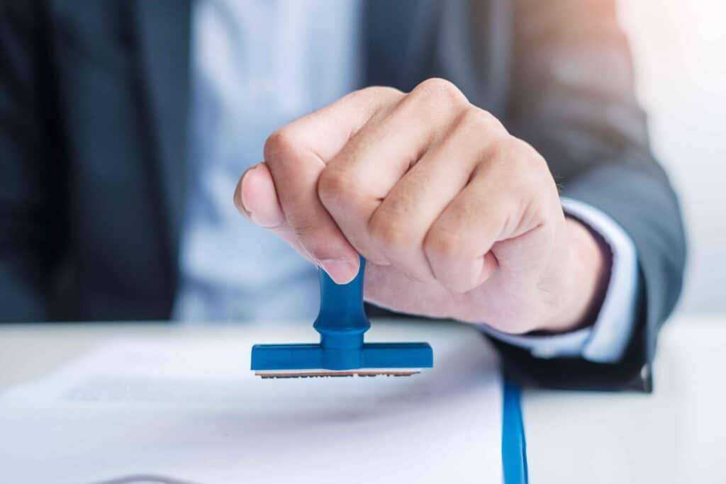 businessman-stamp-during-signing-contract-document-2023-11-27-05-09-49-utc_11zon