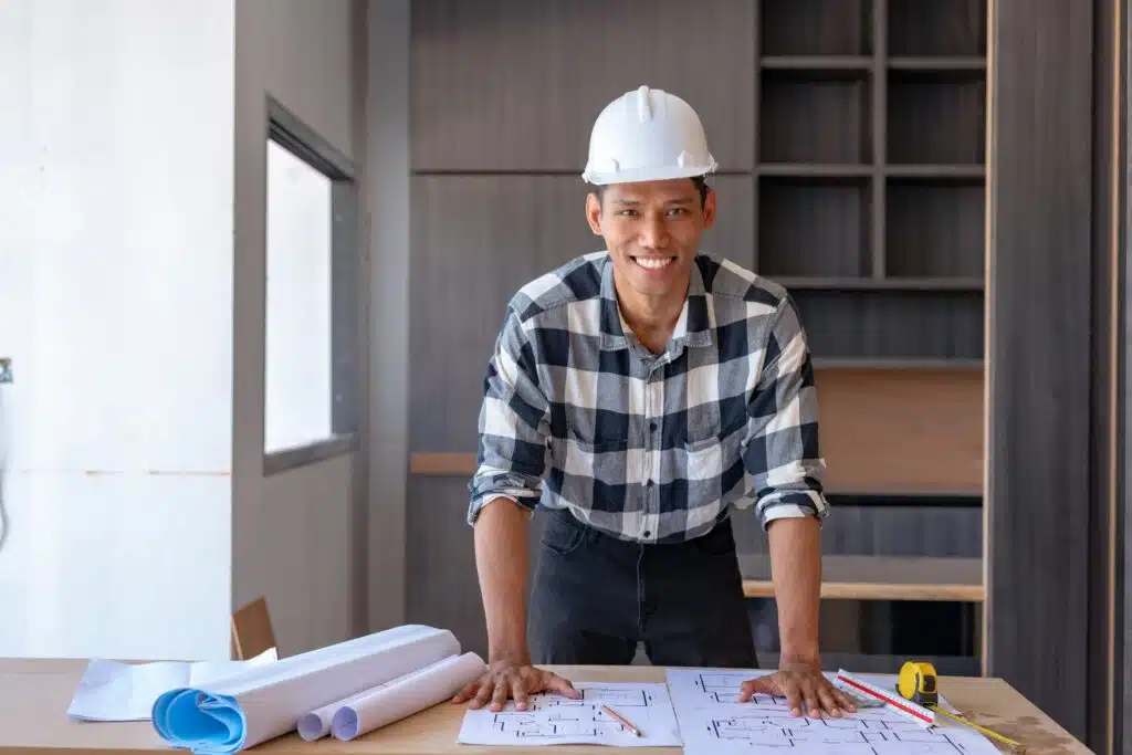 cheerful-young-asian-man-architect-reviews-buildin-2024-01-30-17-54-42-utc_11zon