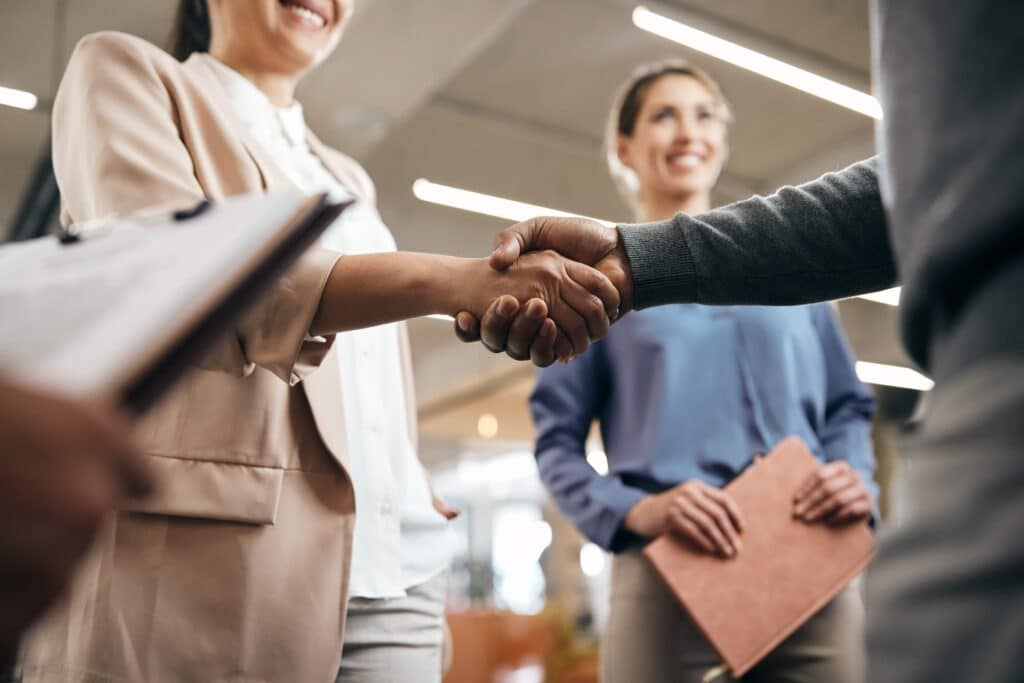 close-up-of-business-partners-shaking-hands-after-2023-11-27-04-55-40-utc_11zon