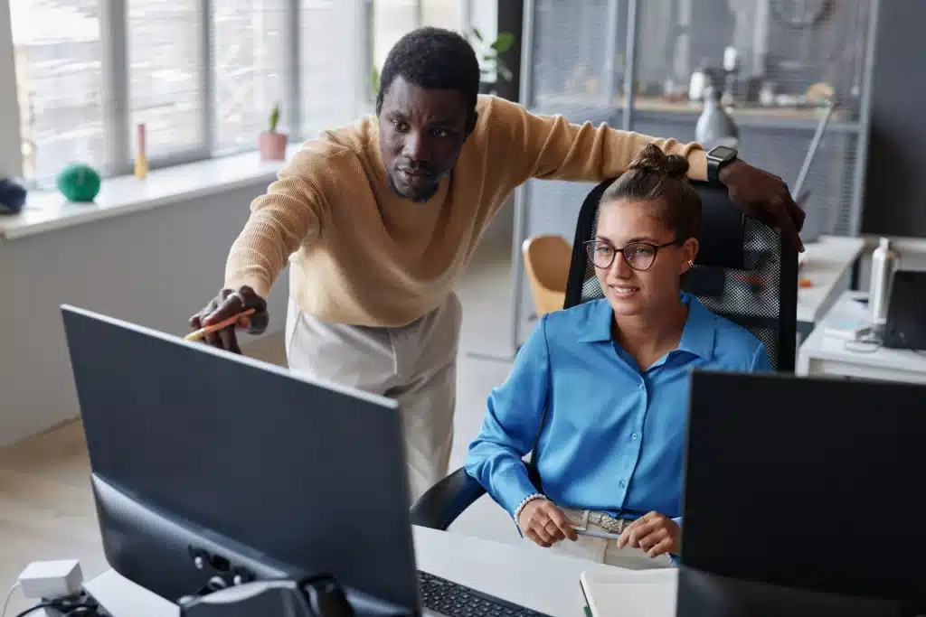 colleagues-developing-new-program-in-team-2023-11-27-05-19-02-utc