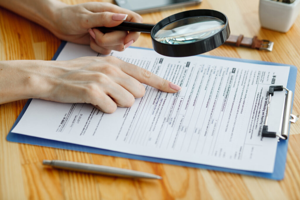 Contract waiting for a notary public sign on desk.