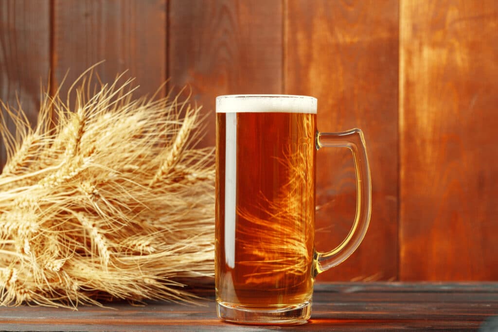 Glass beer on wood background