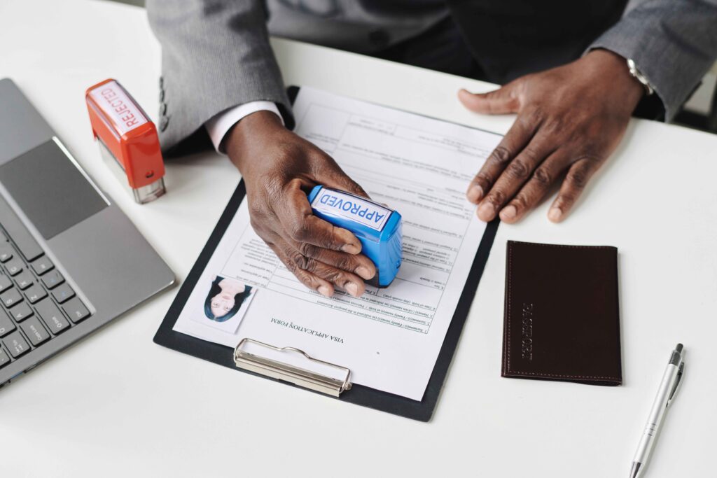 man-approving-visa-in-office-2023-11-27-05-12-12-utc_11zon