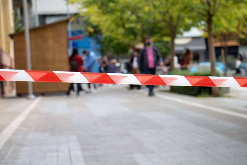 Warning tape, passage is prohibited concept. Red and white stripes caution tape. Coronavirus COVID 19 testing area