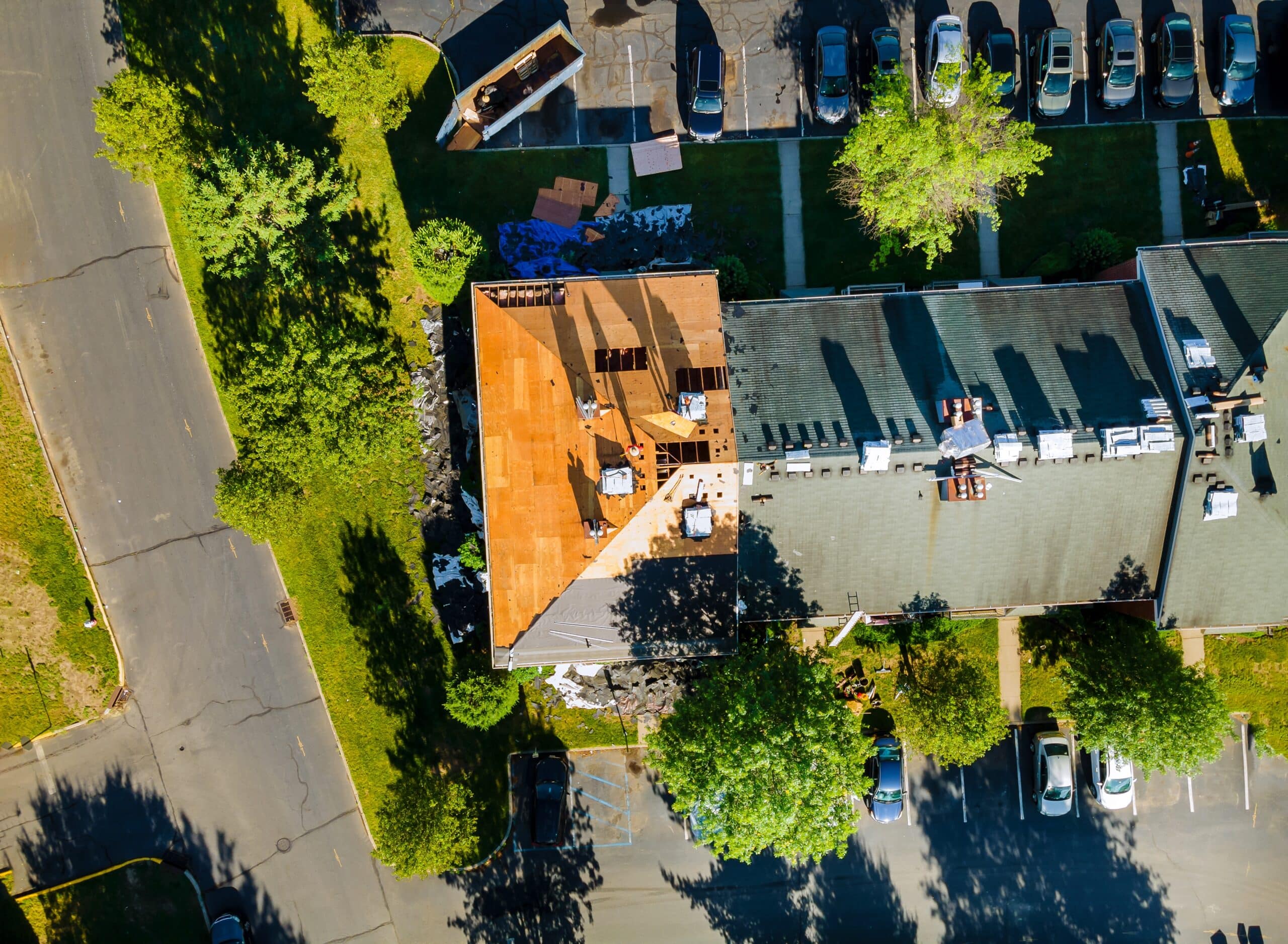 Roof construction removal of old roof, replacement with new shingles, equipment repair of all housing projects in apartment building