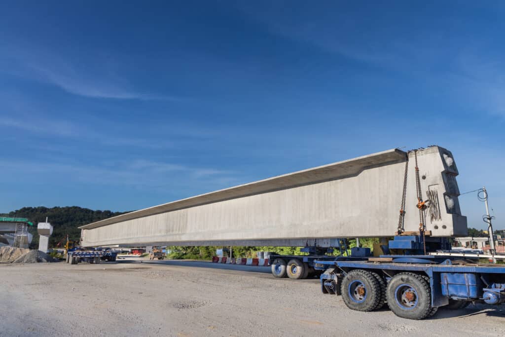 Truck transport pre-fabricated concrete beam to construct light rail transit infrastructure in Malaysia
